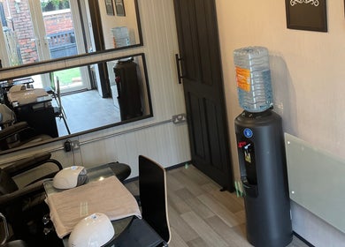 Interior of Polished of Swinton in Swinton, England, GB, showcasing a mirrored wall and salon chairs.