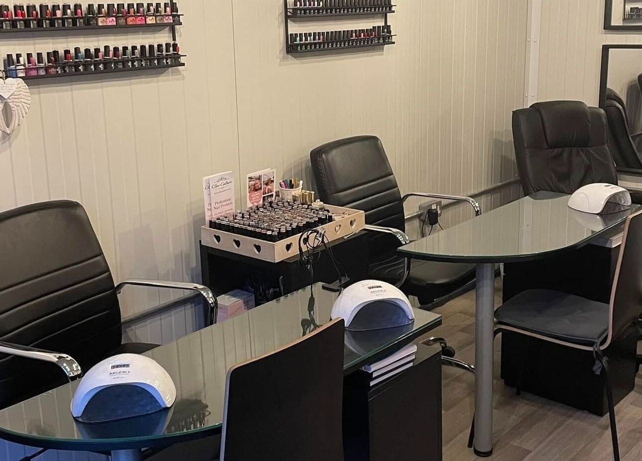 Modern nail studio at Polished of Swinton, Swinton, England, GB with sleek black chairs and polish display.