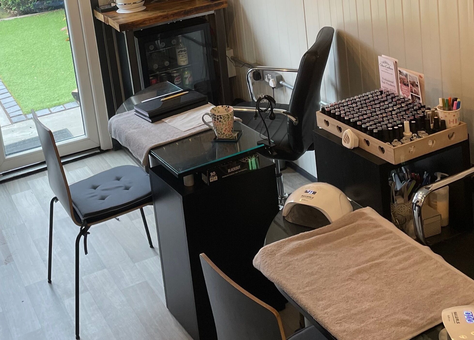 Cozy nail treatment area at Polished of Swinton in Swinton, England, GB, featuring manicure tools and products.