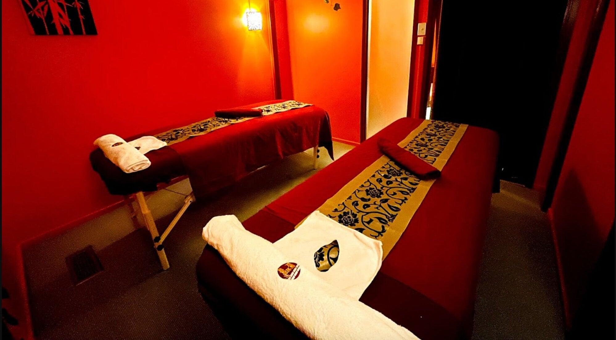 Relaxing massage room at Bamboo Spa Phillipstown, Christchurch, Canterbury, NZ, with warm lighting and decor.