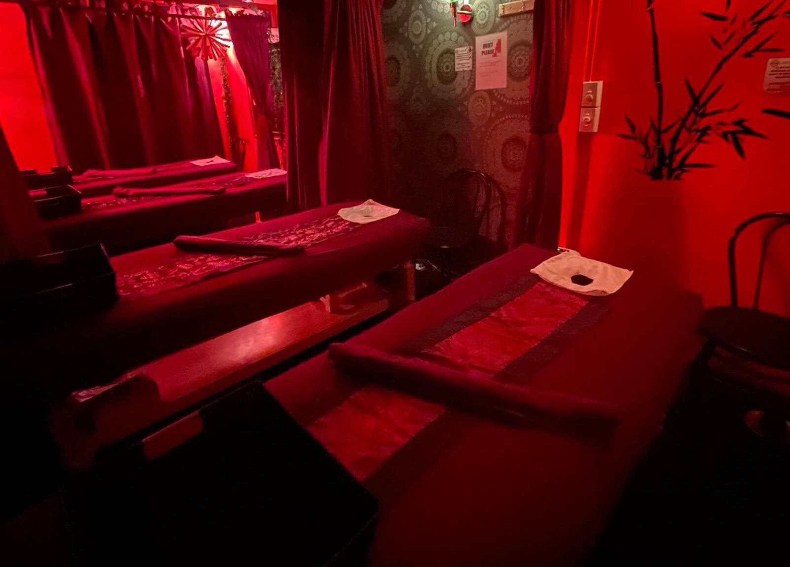 Relaxing massage room with red lighting at Bamboo Spa Christchurch Central, Christchurch, Canterbury, NZ.