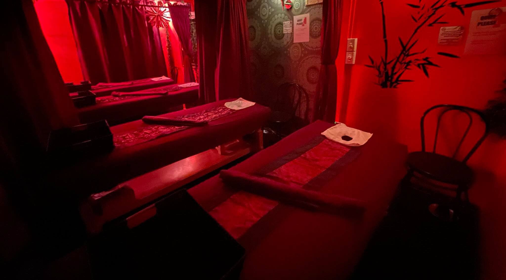 Relaxing massage room with red lighting at Bamboo Spa Christchurch Central, Christchurch, Canterbury, NZ.