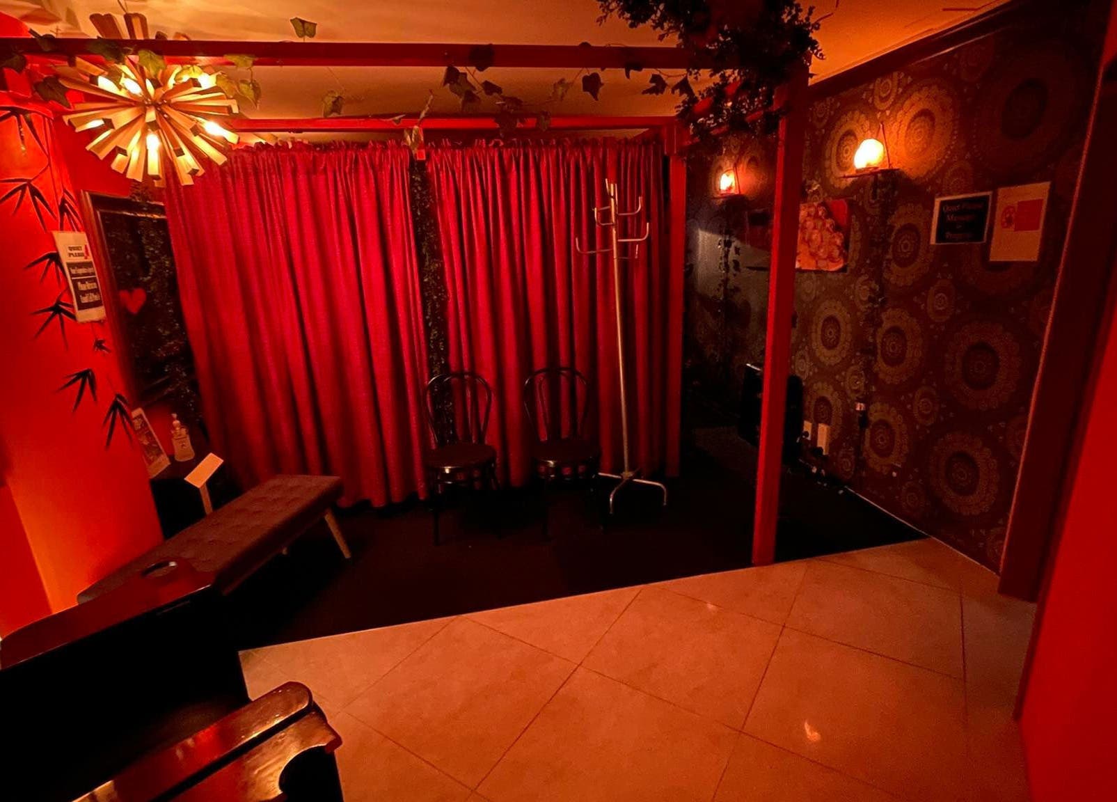 Relaxing interior of Bamboo Spa Christchurch Central with ambient red lighting in Christchurch, Canterbury, NZ.