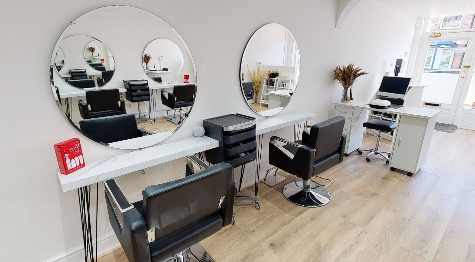 Chic Hair By April Cole in Ruddington, England, GB. Modern salon interior with stylish mirrors and seating.