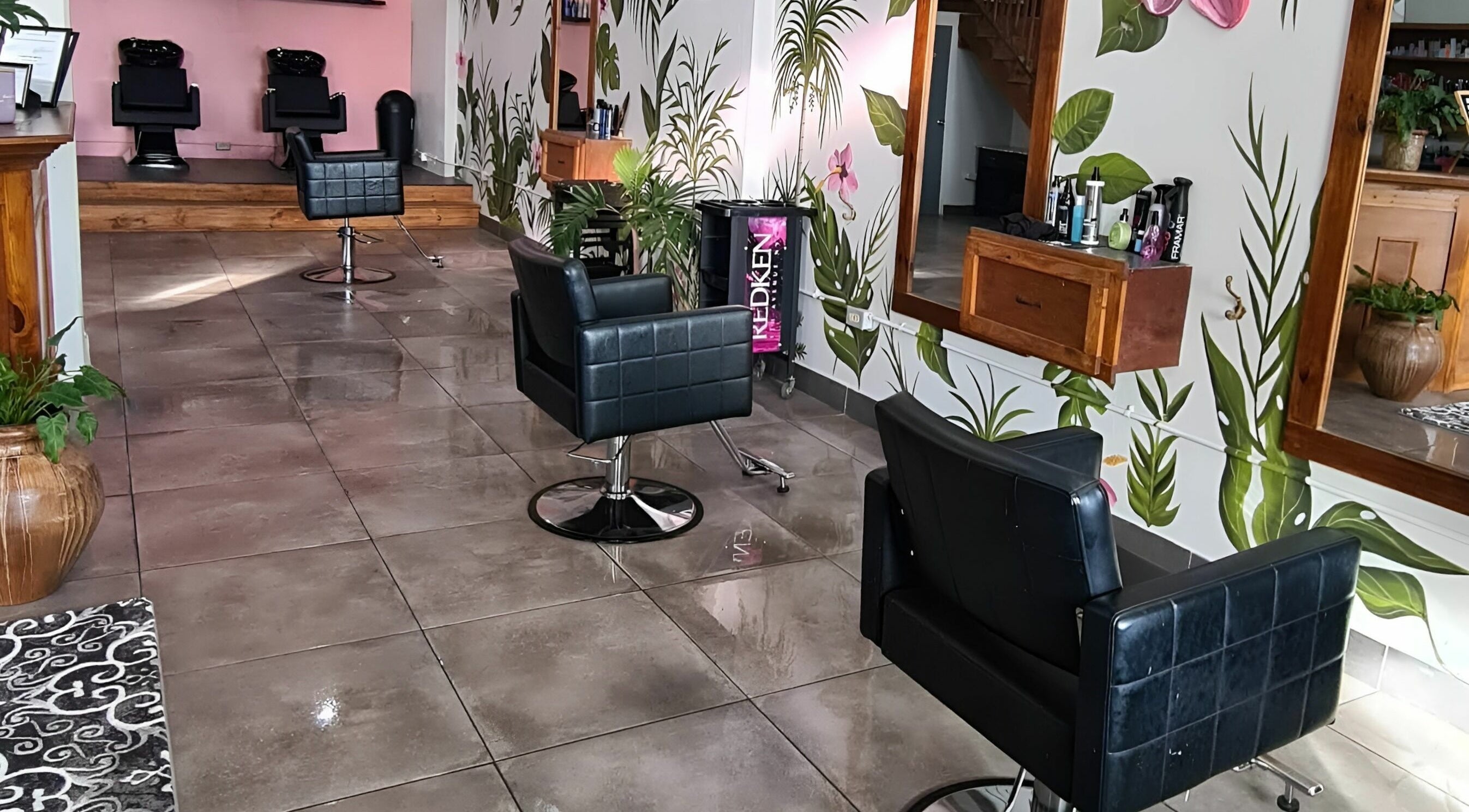 Chic salon interior with floral decor at Thecolorbar, Aguadilla, PR, US.