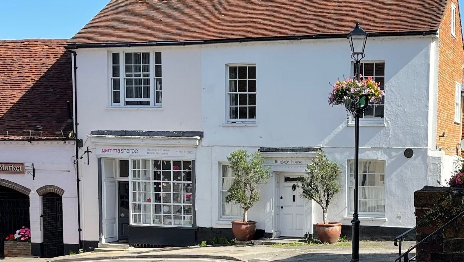 Front view of Gemma Sharpe Organic, a beauty venue in Midhurst, England, GB, featuring white walls and floral accents.