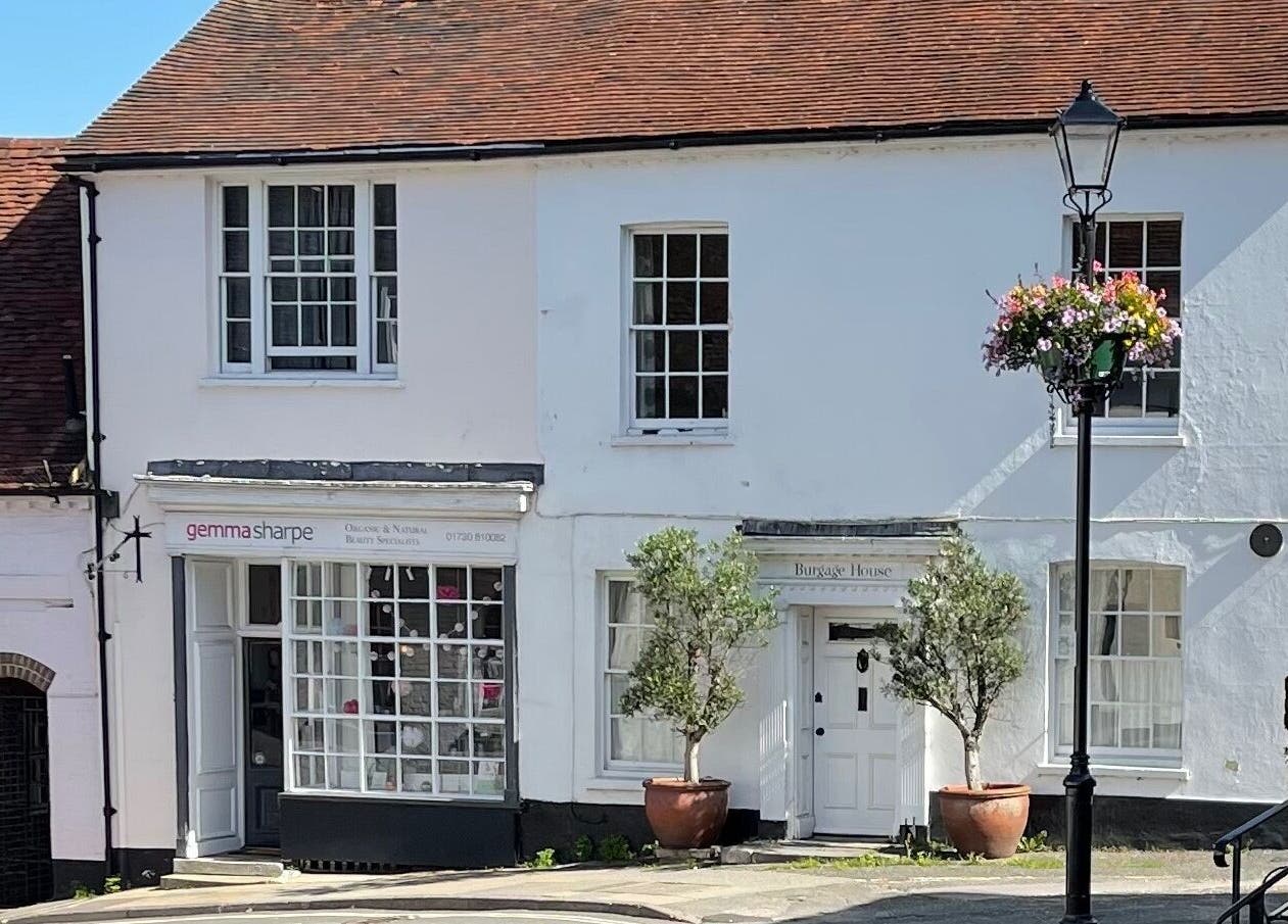 Front view of Gemma Sharpe Organic, a beauty venue in Midhurst, England, GB, featuring white walls and floral accents.