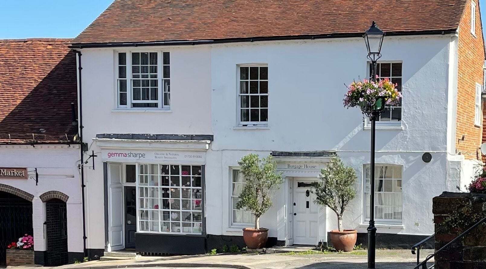 Front view of Gemma Sharpe Organic, a beauty venue in Midhurst, England, GB, featuring white walls and floral accents.