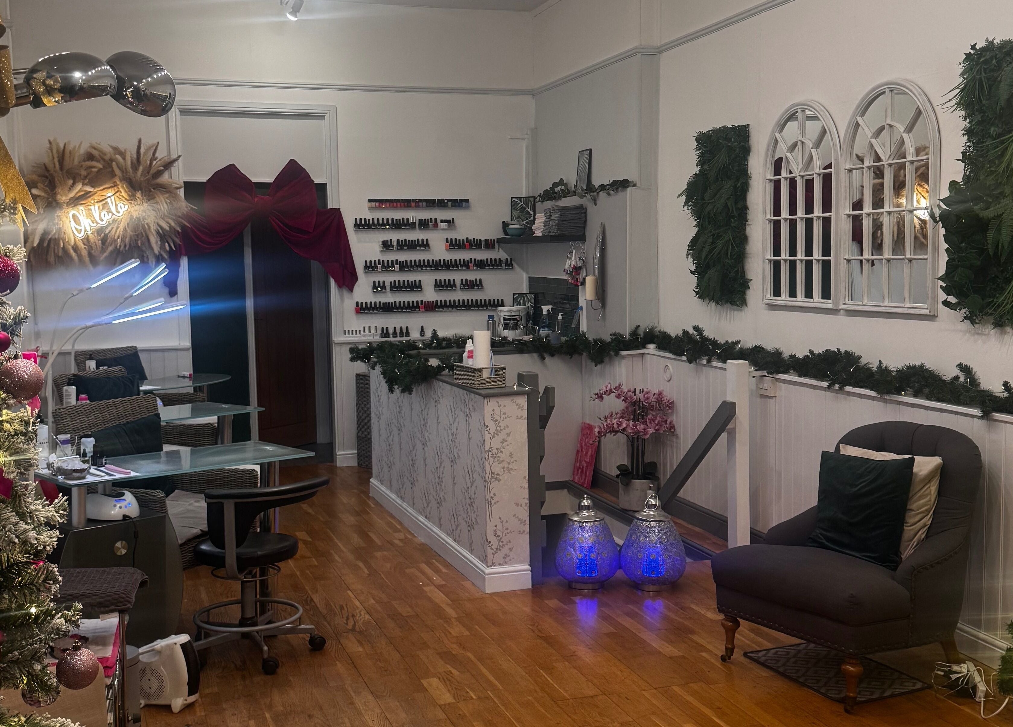 Interior of Gemma Sharpe Organic in Midhurst, England, GB, featuring chic decor with nail polish display and cozy seating.