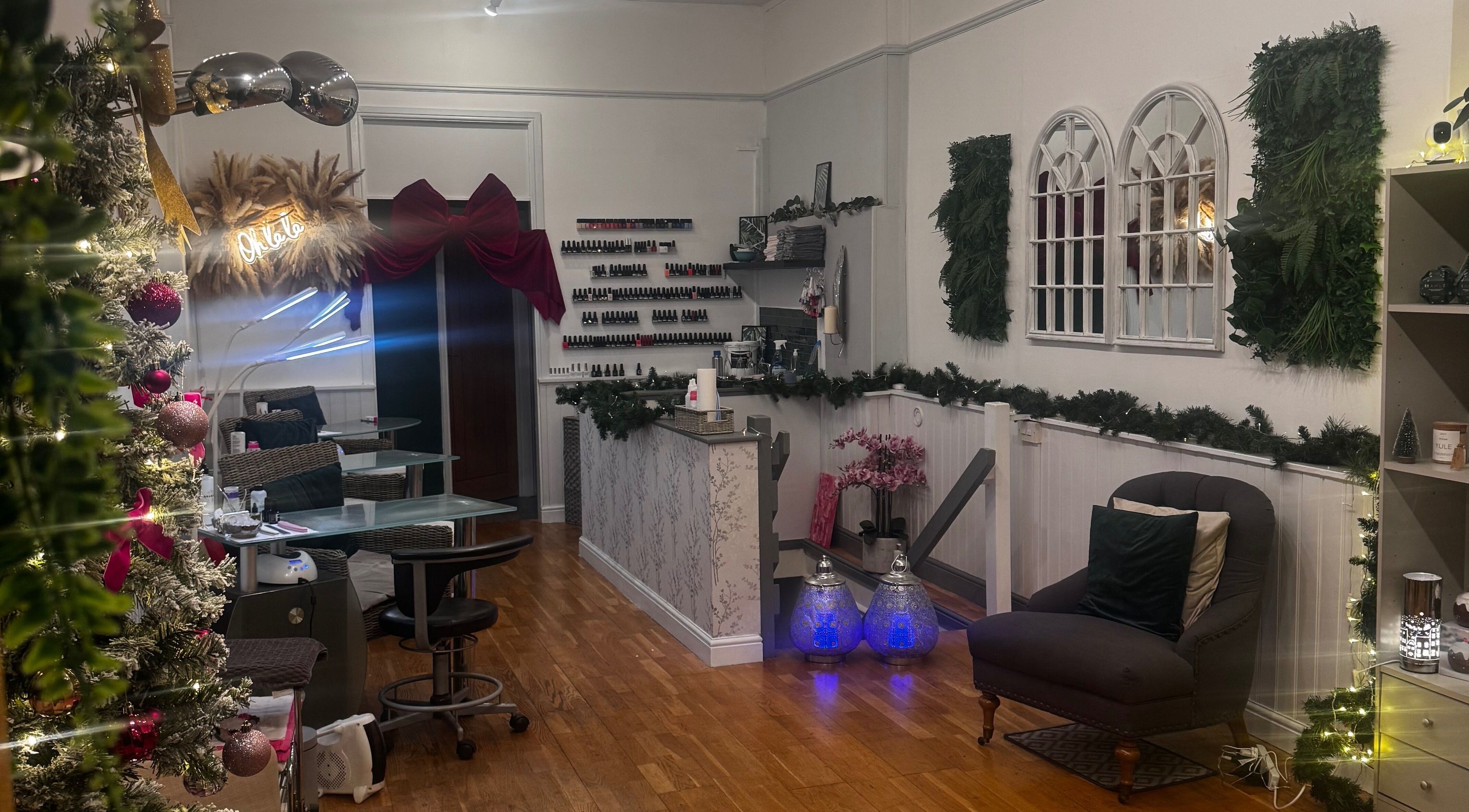 Interior of Gemma Sharpe Organic in Midhurst, England, GB, featuring chic decor with nail polish display and cozy seating.