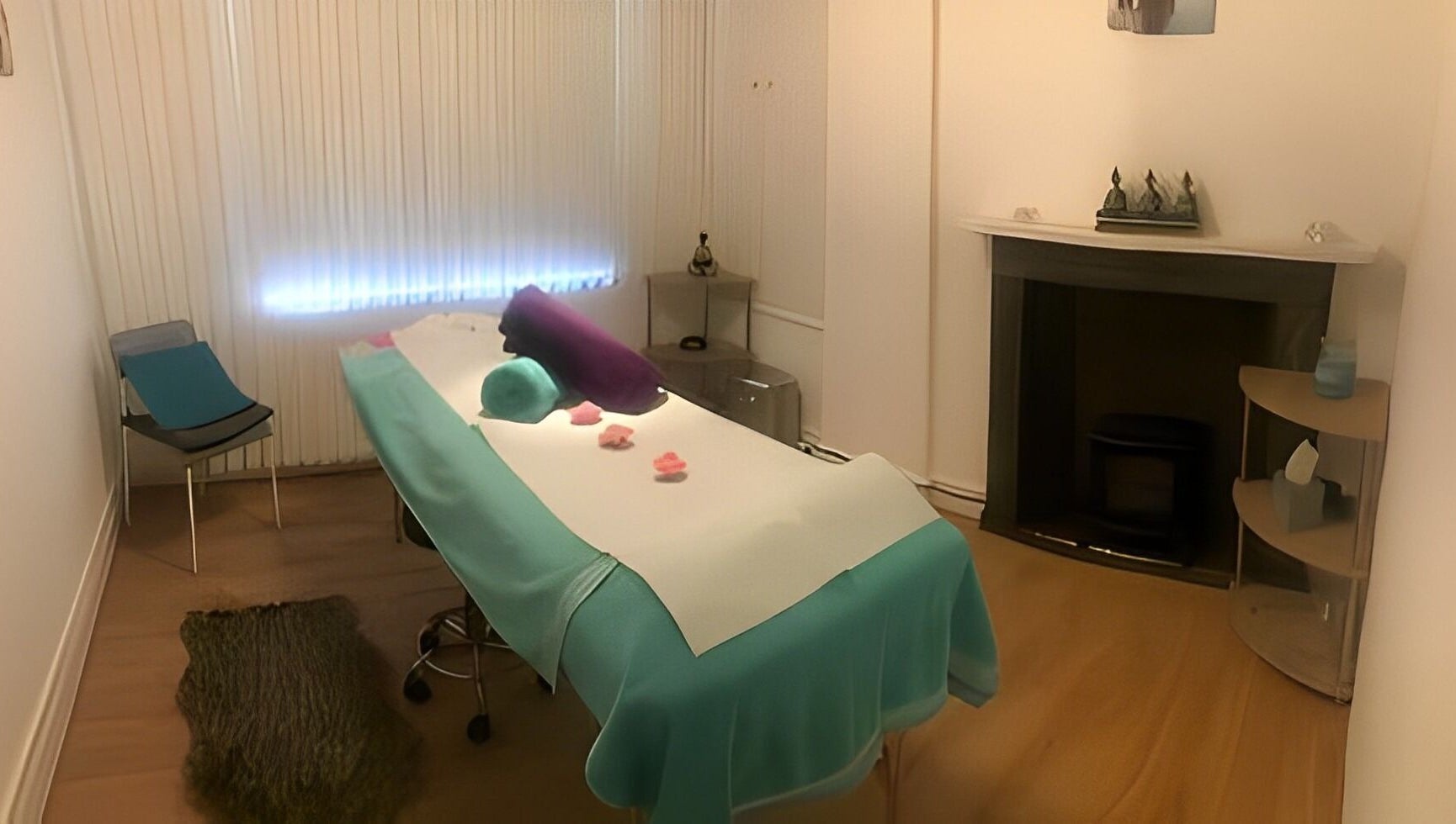 Relaxing massage room at Escape Spa and Massage, Worcester, England, GB, featuring a cozy treatment bed and ambient lighting.