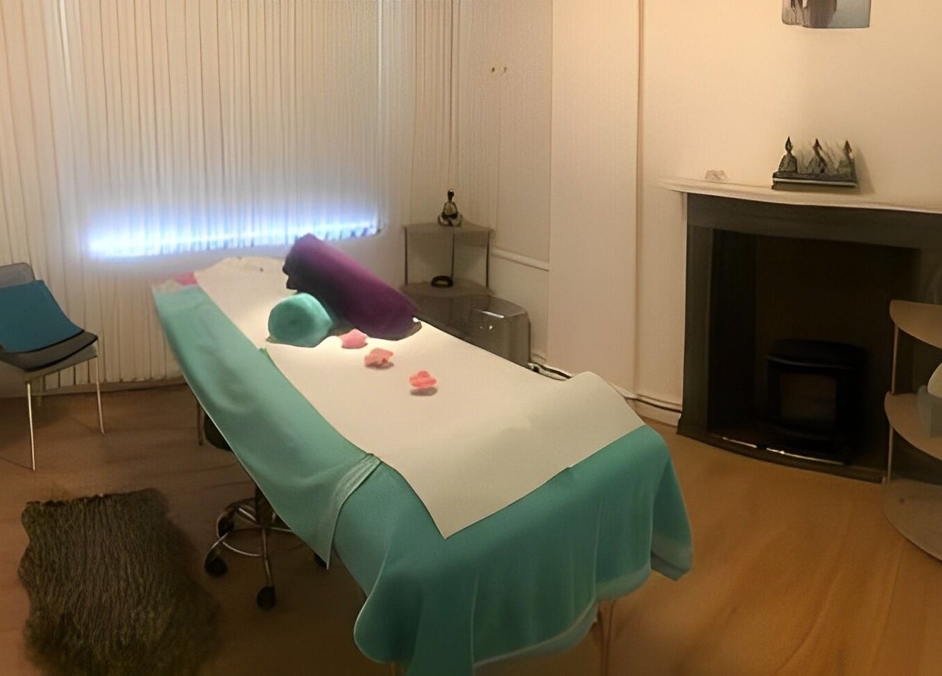 Relaxing massage room at Escape Spa and Massage, Worcester, England, GB, featuring a cozy treatment bed and ambient lighting.