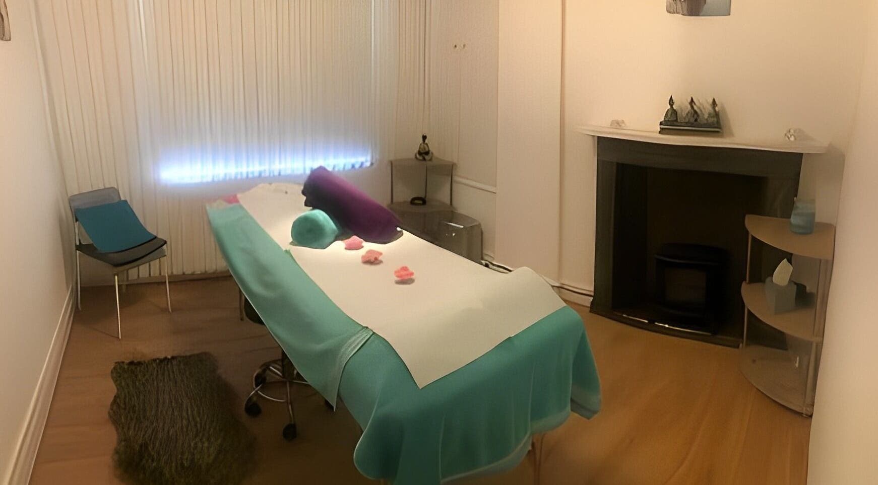 Relaxing massage room at Escape Spa and Massage, Worcester, England, GB, featuring a cozy treatment bed and ambient lighting.