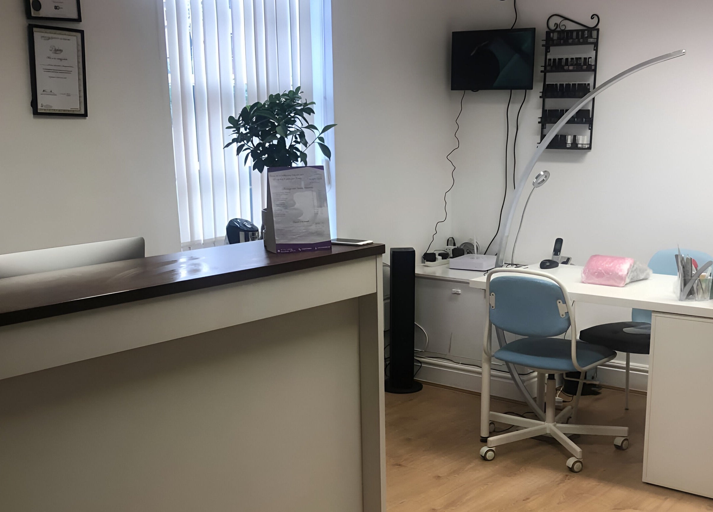 Welcoming reception area at Escape Spa and Massage, Worcester, England, GB, featuring a modern desk and seating.