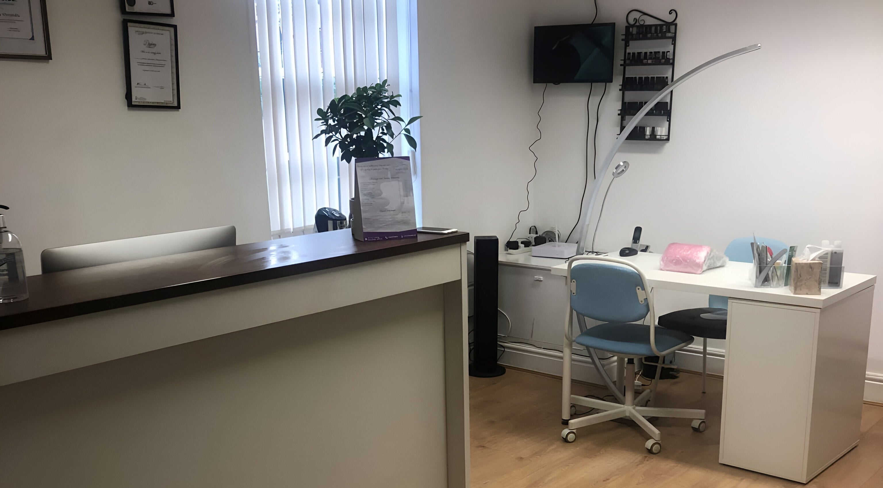 Welcoming reception area at Escape Spa and Massage, Worcester, England, GB, featuring a modern desk and seating.