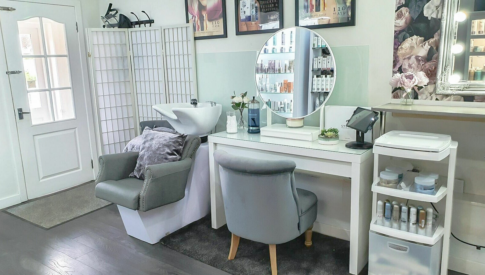 Elegant styling station at 110 On Ayr Hair Salon, Glasgow, Scotland, GB, showcasing modern decor and luxury products.