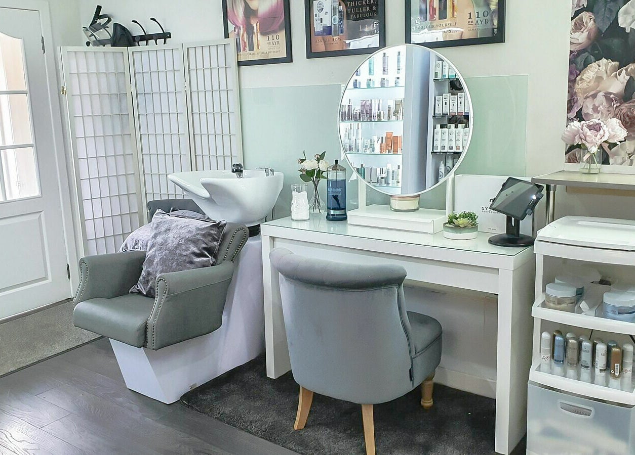 Elegant styling station at 110 On Ayr Hair Salon, Glasgow, Scotland, GB, showcasing modern decor and luxury products.