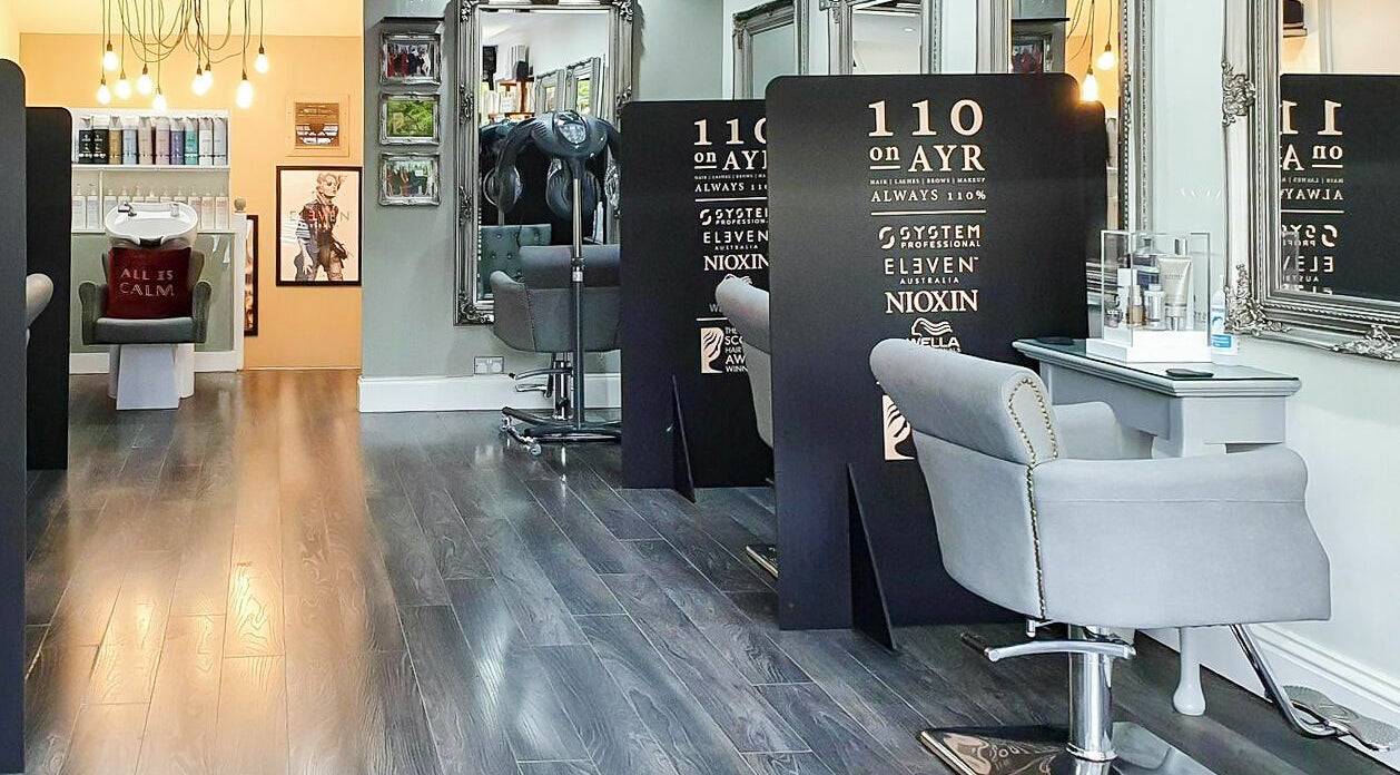 Interior of 110 On Ayr Hair Salon in Glasgow, Scotland, GB showcasing modern decor and styling stations.