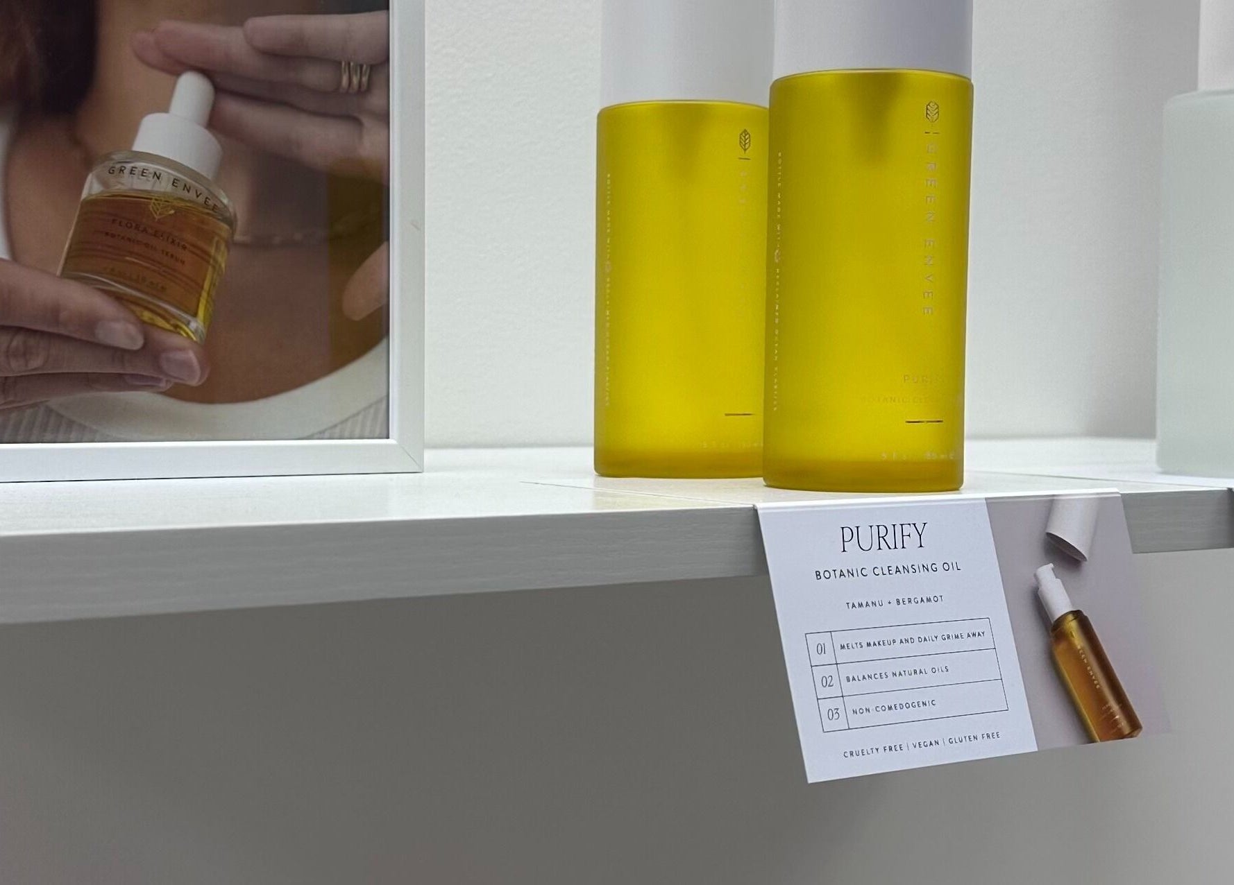 Beauty products displayed at Pretty Hurts, Leduc, Alberta, CA, showcasing botanic cleansing oil and facial mist.