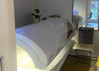Tanning bed in modern room at Sparrow Beauty Co., Nelson, British Columbia, CA, offering premium wellness services.