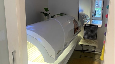 Tanning bed in modern room at Sparrow Beauty Co., Nelson, British Columbia, CA, offering premium wellness services.