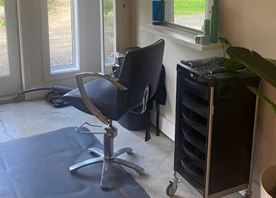 Relaxing salon chair at Sparrow Beauty Co., Nelson, British Columbia, CA, near a window for natural light.