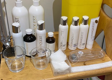 Dermaquest skincare products at Coco Aesthetics & Beauty, Coal Aston, England, GB displayed neatly on a wooden shelf.