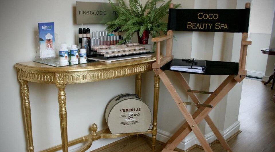 Coco Aesthetics & Beauty in Coal Aston, England showcases luxury chair and golden makeup station.