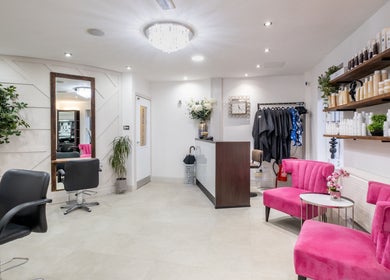 Emava salon interior with pink chairs and elegant decor in Solihull, England, GB.