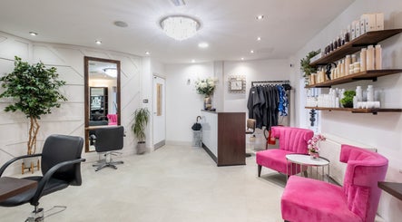 Emava salon interior with pink chairs and elegant decor in Solihull, England, GB.