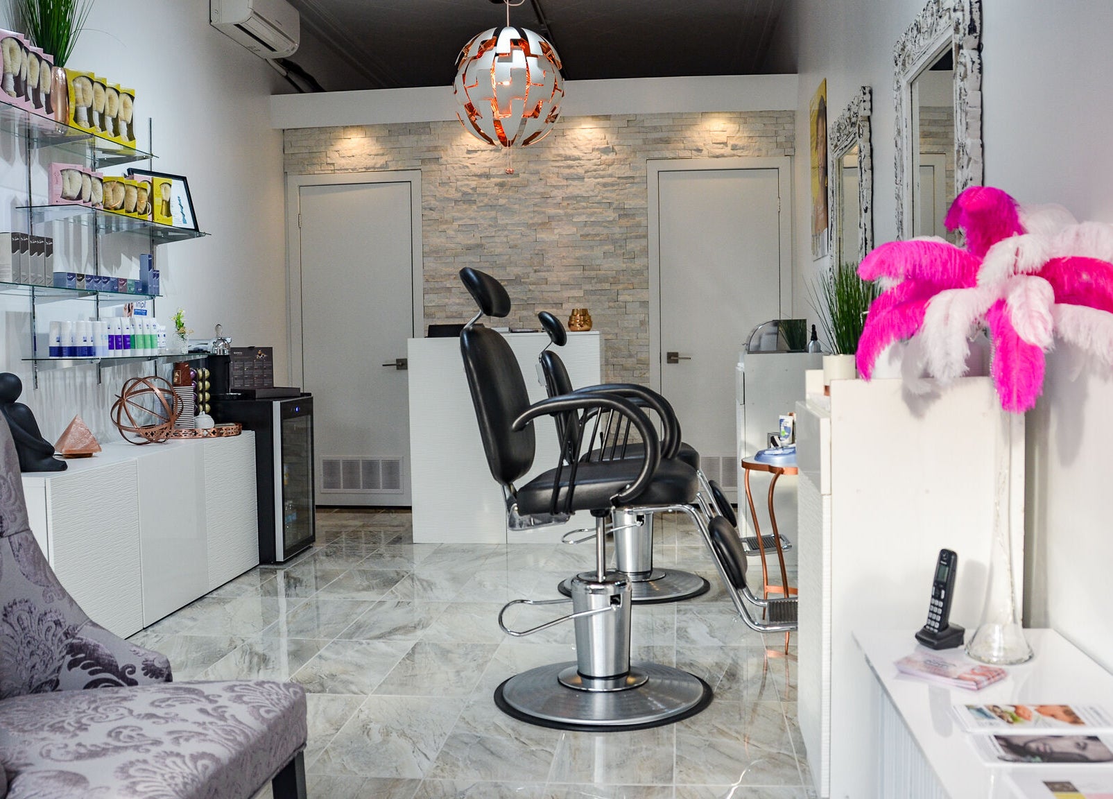 Modern interior of Jade Thread and Wax Bar - Bayview in Toronto, Ontario, CA, featuring elegant salon chairs and decor.