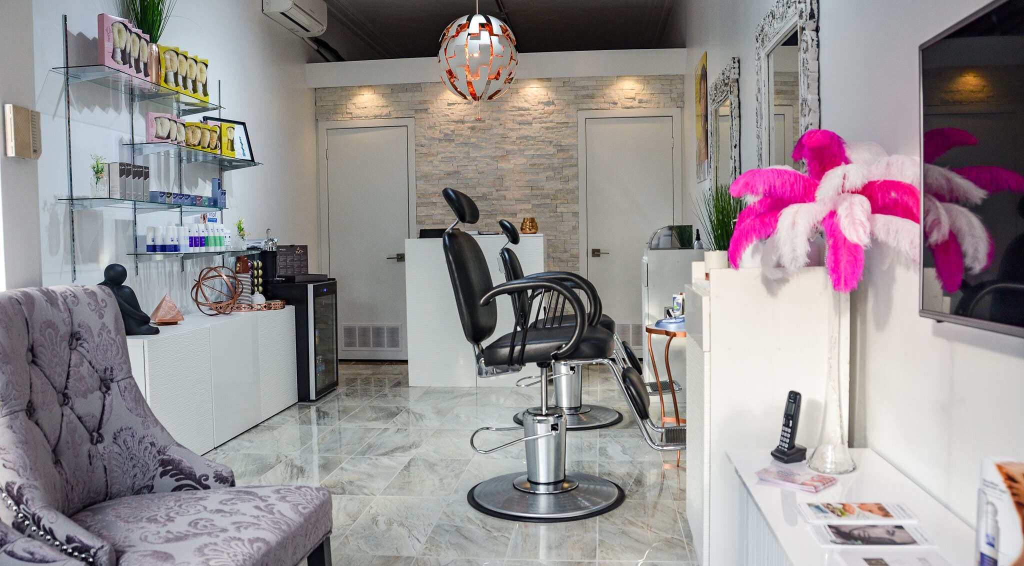 Modern interior of Jade Thread and Wax Bar - Bayview in Toronto, Ontario, CA, featuring elegant salon chairs and decor.