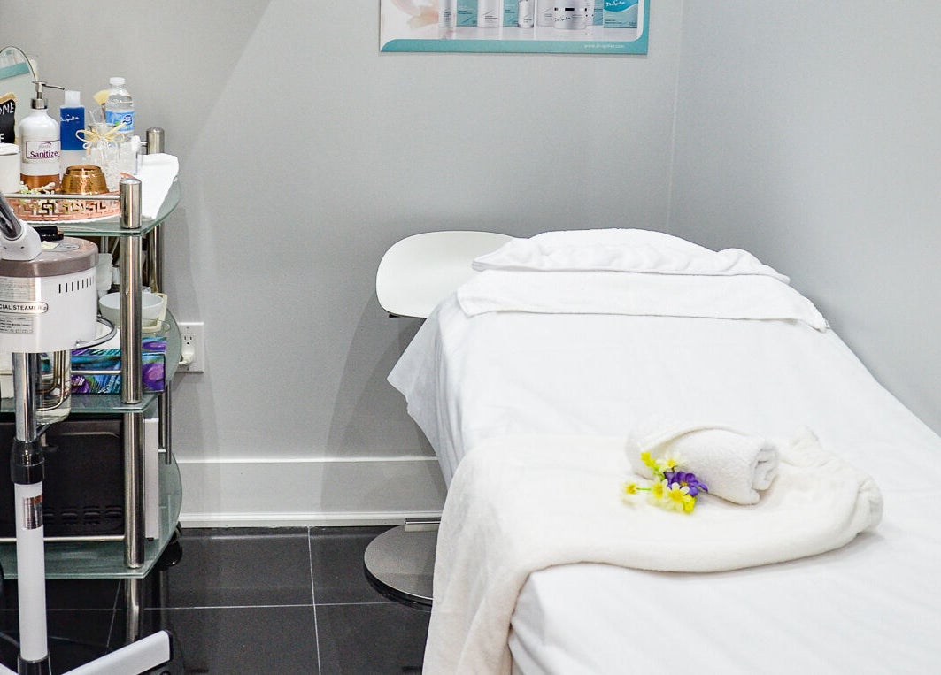 Relaxing spa treatment room at Jade Thread and Wax Bar - Bayview, Toronto, Ontario, CA with facial steamer.