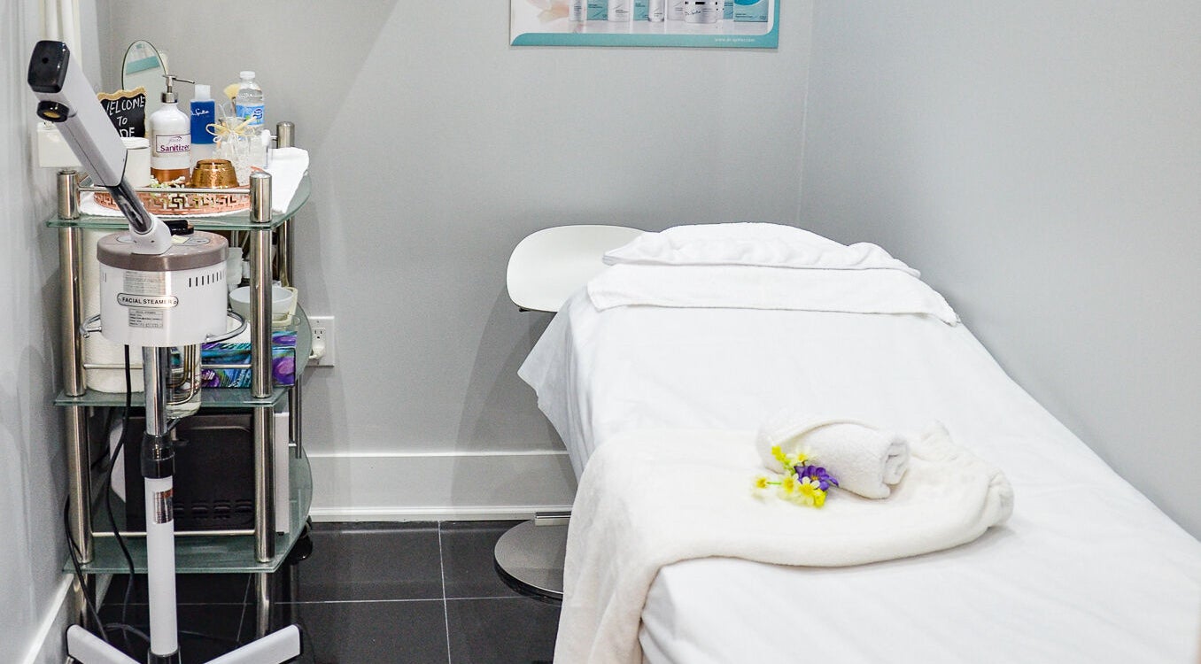 Relaxing spa treatment room at Jade Thread and Wax Bar - Bayview, Toronto, Ontario, CA with facial steamer.