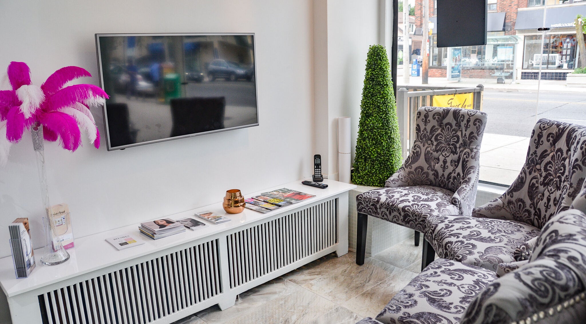 Elegant waiting area at Jade Thread and Wax Bar - Bayview in Toronto, Ontario, CA with plush chairs and decor.