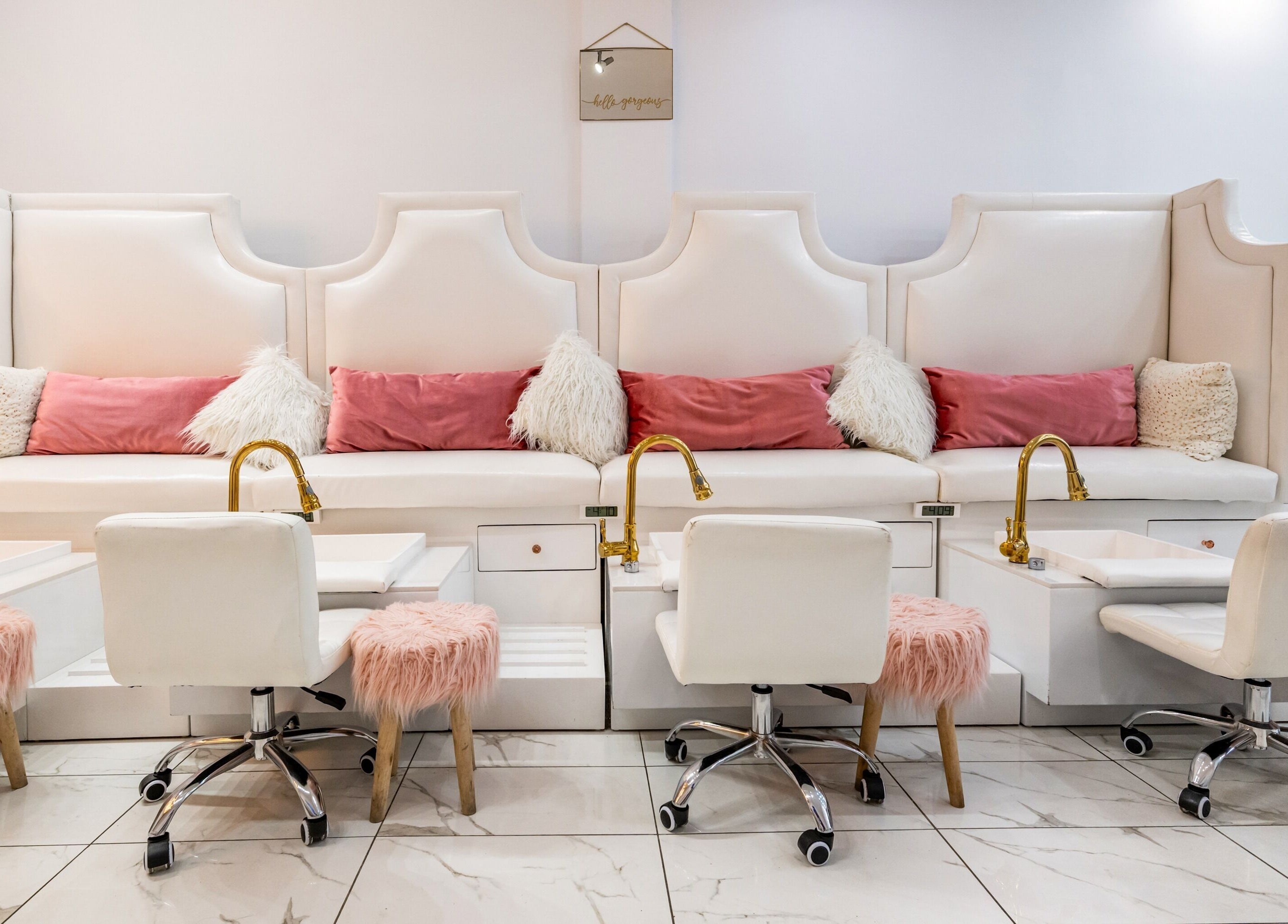 Elegant pedicure stations at Jade Thread and Wax Bar - Danforth, Toronto, Ontario, CA with plush seating and chic decor.