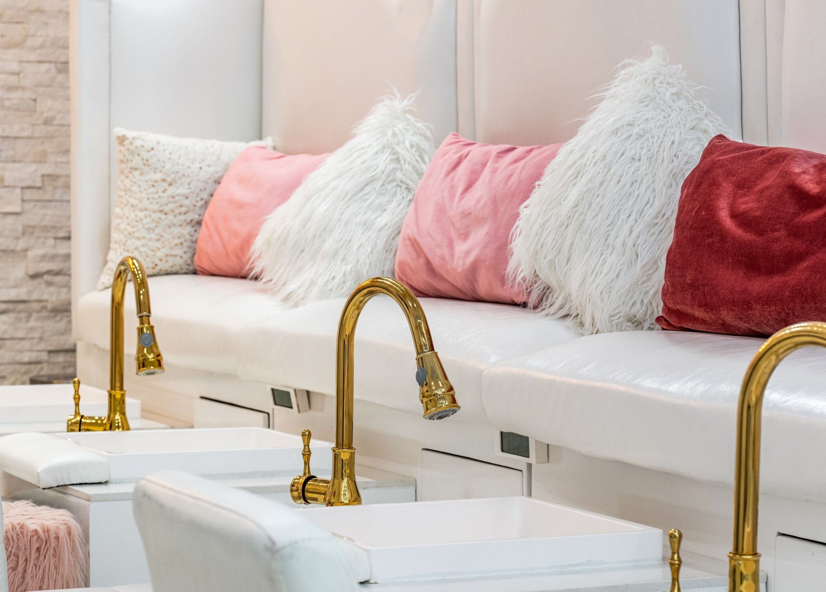 Pedicure area with plush cushions at Jade Thread and Wax Bar - Danforth, Toronto, Ontario, CA.