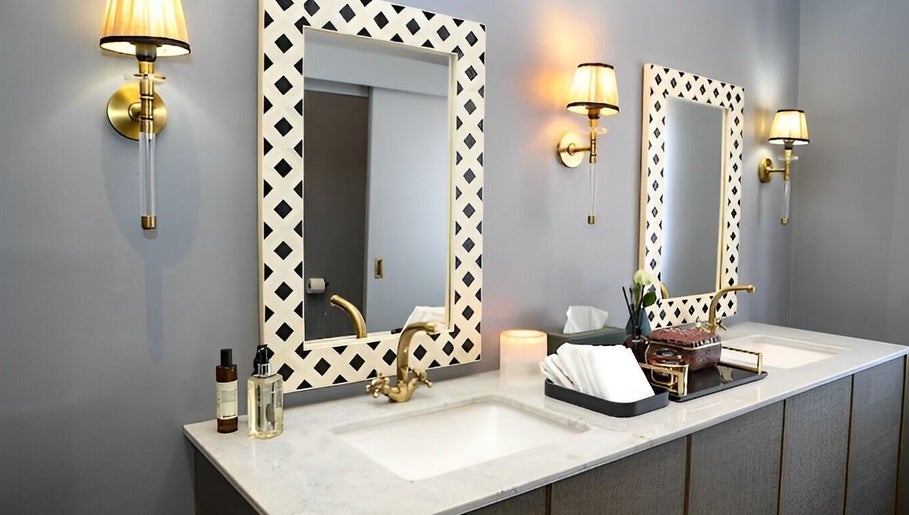 Stylish bathroom vanity at Body Beautiful Durban, Durban North, KwaZulu-Natal, ZA, featuring chic lighting.