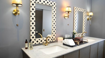 Stylish bathroom vanity at Body Beautiful Durban, Durban North, KwaZulu-Natal, ZA, featuring chic lighting.