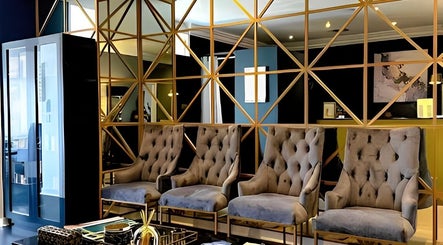 Sophisticated lounge with plush chairs at Body Beautiful Durban, Durban North, KwaZulu-Natal, ZA.