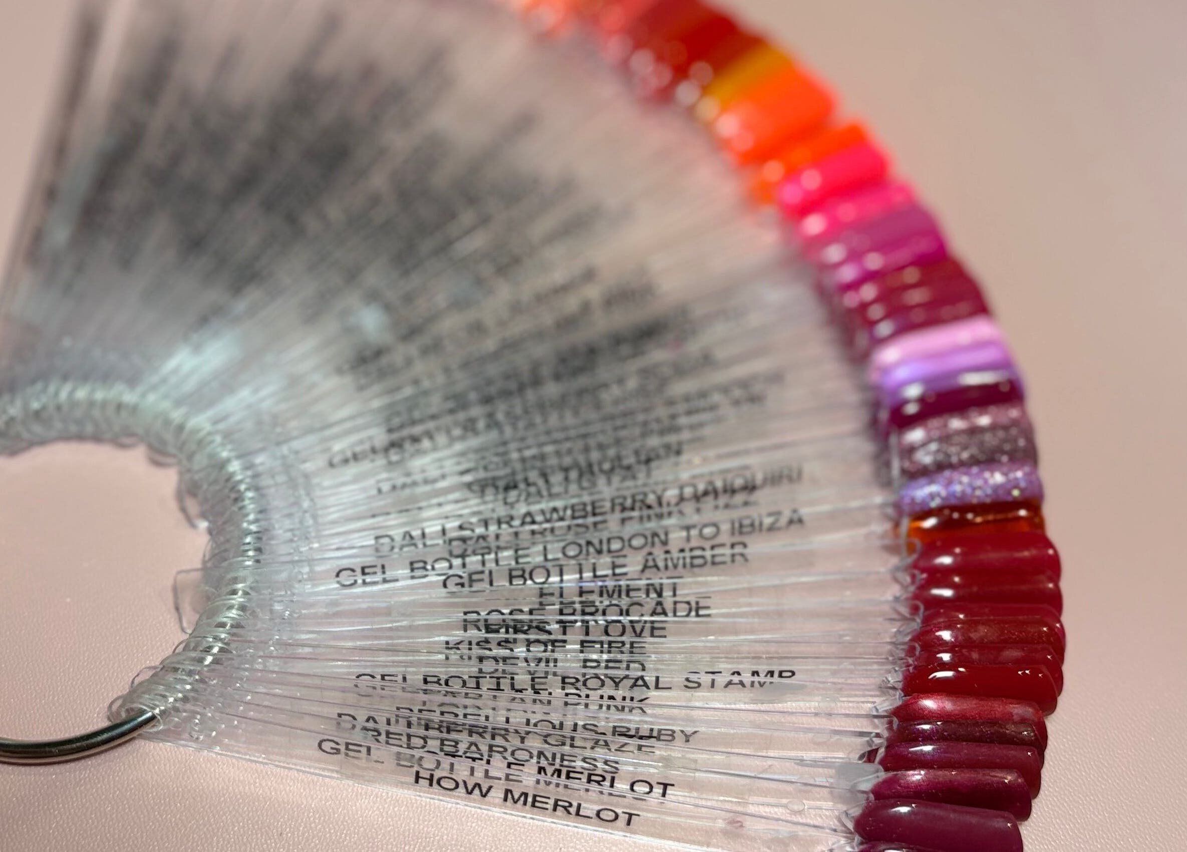 Colorful nail polish samples at Kirsty’s Beauty, Poole, England, GB, showcasing diverse manicure options.