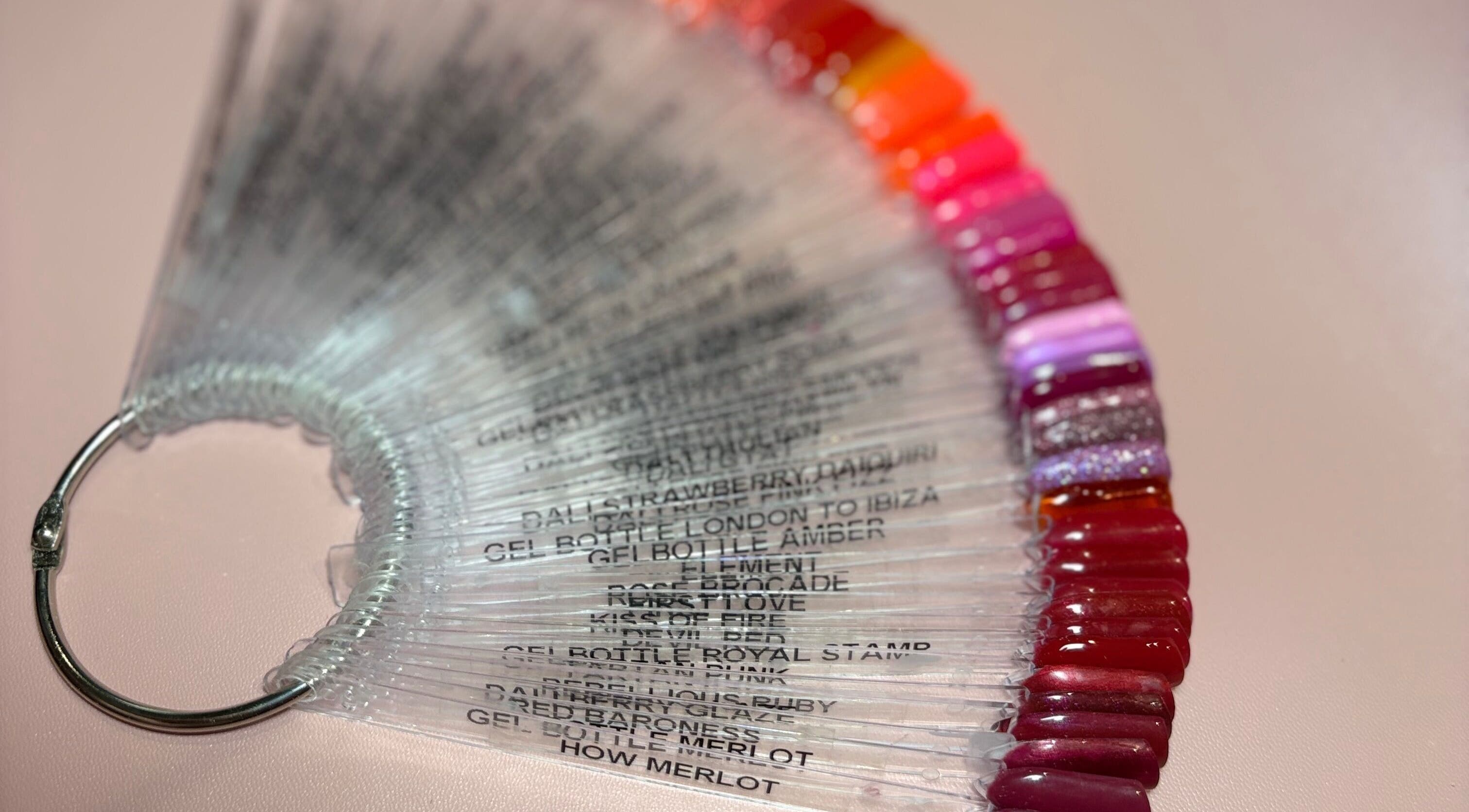 Colorful nail polish samples at Kirsty’s Beauty, Poole, England, GB, showcasing diverse manicure options.