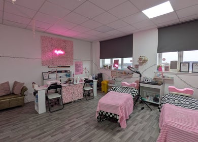 Warm, inviting treatment area at Blossom Beauty and Training Academy, Glasgow, Scotland, GB, with pink decor.