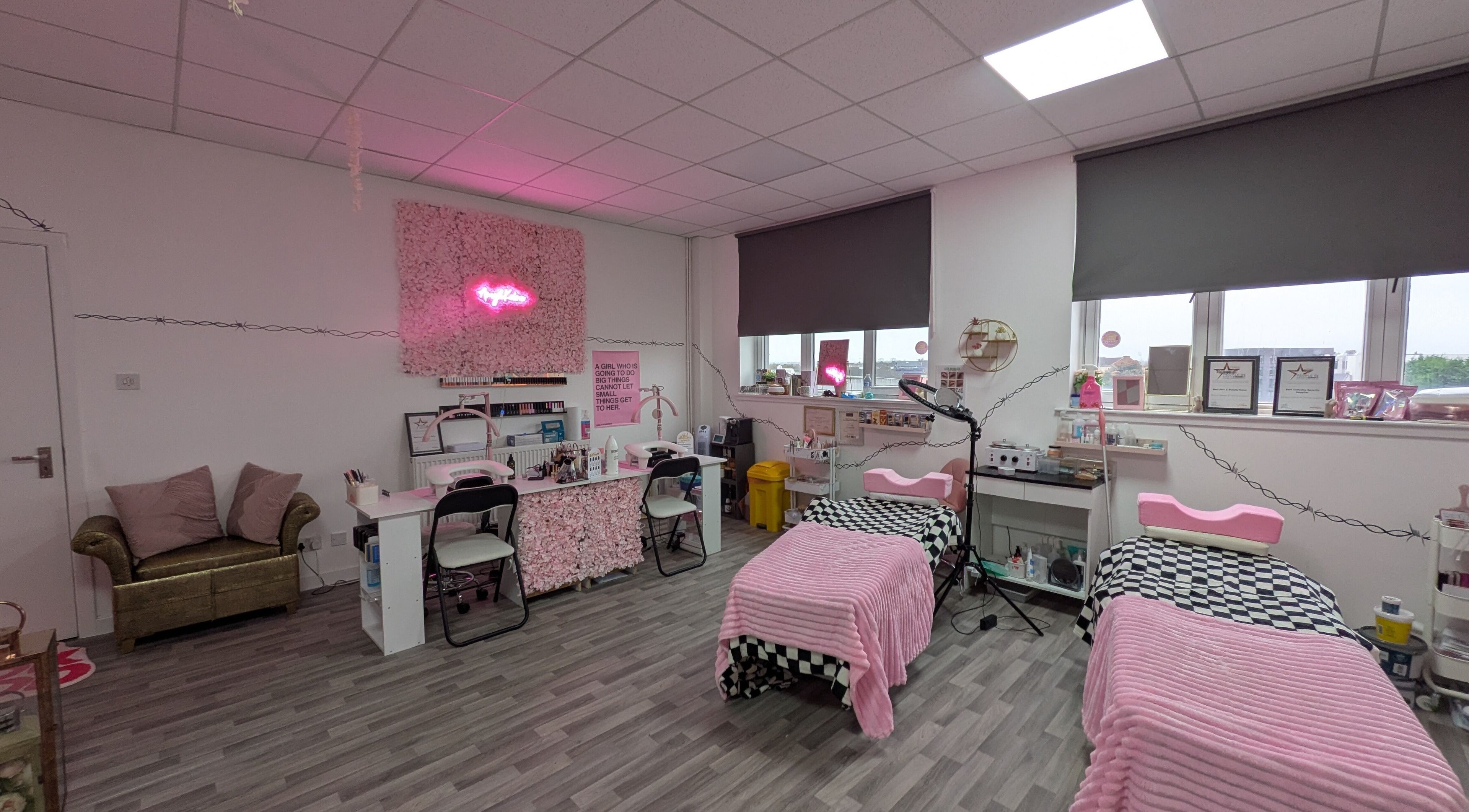 Warm, inviting treatment area at Blossom Beauty and Training Academy, Glasgow, Scotland, GB, with pink decor.