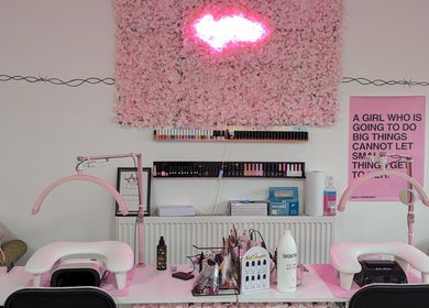 Chic nail station at Blossom Beauty and Training Academy, Glasgow, Scotland, GB, featuring pink decor and tools.