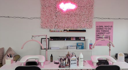 Chic nail station at Blossom Beauty and Training Academy, Glasgow, Scotland, GB, featuring pink decor and tools.