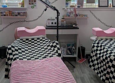 Cozy treatment room at Blossom Beauty and Training Academy, Glasgow, Scotland, GB with pink accents.