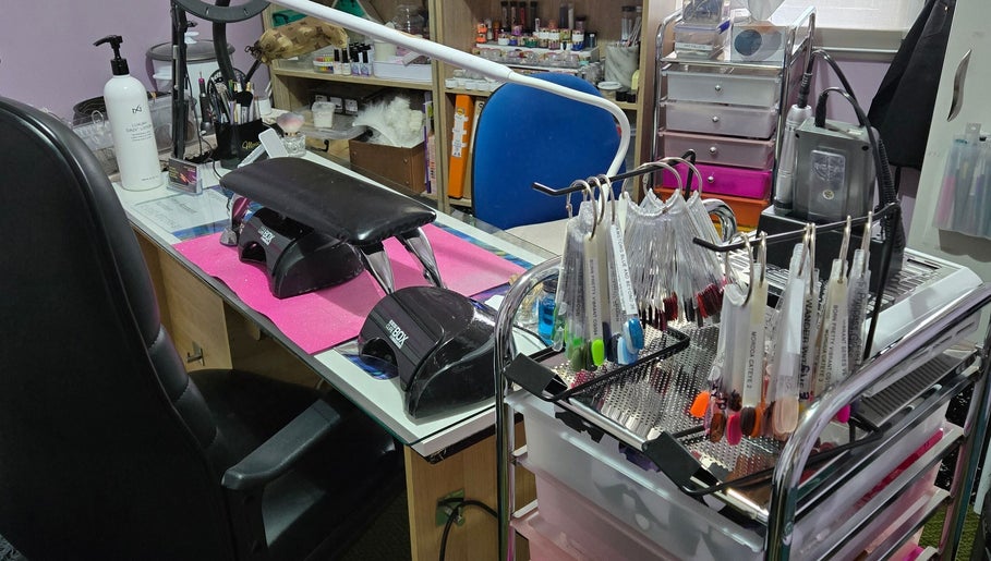 JNT Nails workspace in Invercargill, Southland, NZ, showing a manicure station with tools and colorful nail samples.
