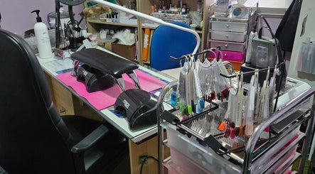 JNT Nails workspace in Invercargill, Southland, NZ, showing a manicure station with tools and colorful nail samples.