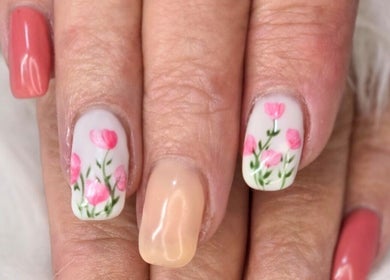 Floral nail design at JNT Nails, Invercargill, Southland, NZ, featuring pink flower accents.